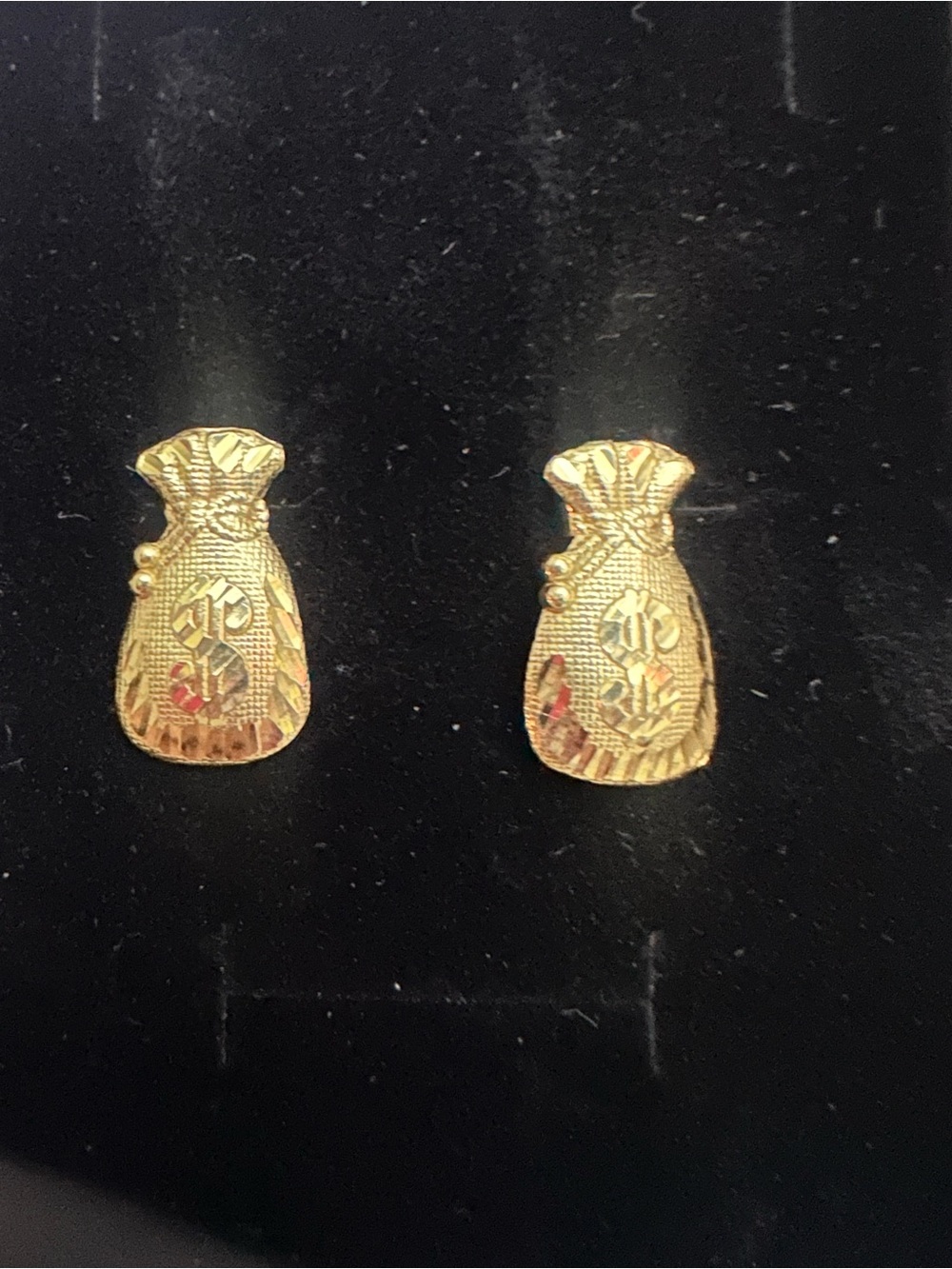 14k Yellow Gold diamond-cut lucky money bag stud earrings.